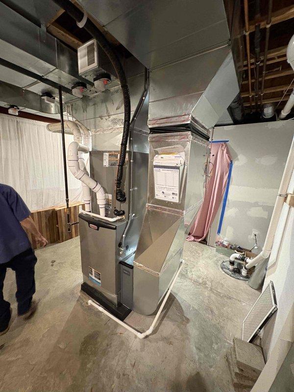 Completed full HVAC system installation in basement mechanical room, including 135,000 BTU Lennox furnace, 5-ton air conditioning unit with front-access coil, zoning system, and humidifier. Installed all necessary ductwork with insulation, refrigerant lines, and PVC condensate drainage. System fully connected, tested, and operational under mechanical permit.