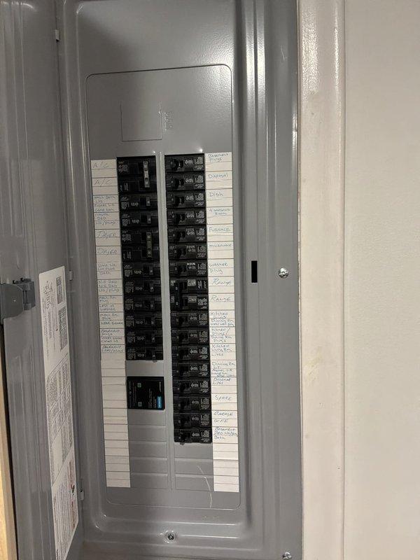 Completed electrical estimate for new whole home generator installation, evaluating either Kohler or Generac unit options. Assessed existing electrical panel capacity and circuit breaker configuration to determine compatibility with generator transfer switch requirements. Documented current electrical infrastructure including main service panel with approximately 20-24 circuit positions and existing conduit routing through utility area near laundry appliances. Identified optimal location for generator placement, transfer switch installation, and necessary electrical connections to integrate automatic backup power system with existing residential electrical distribution.