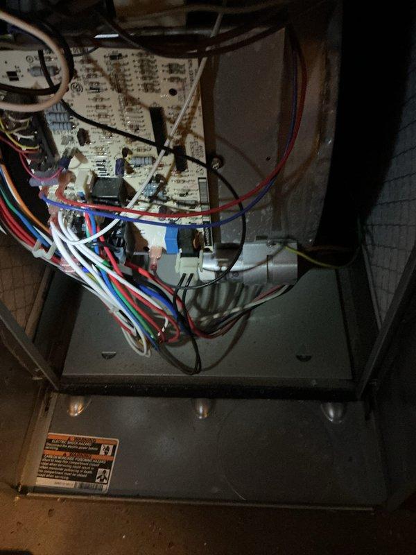 Completed annual HVAC maintenance inspection on air handling system. Performed comprehensive system evaluation including control board inspection, verified thermostat operation and temperature readings at 77°F, checked electrical connections and wiring integrity throughout the unit, and inspected blower housing assembly. All components found operating within normal parameters with no immediate service needs identified.
