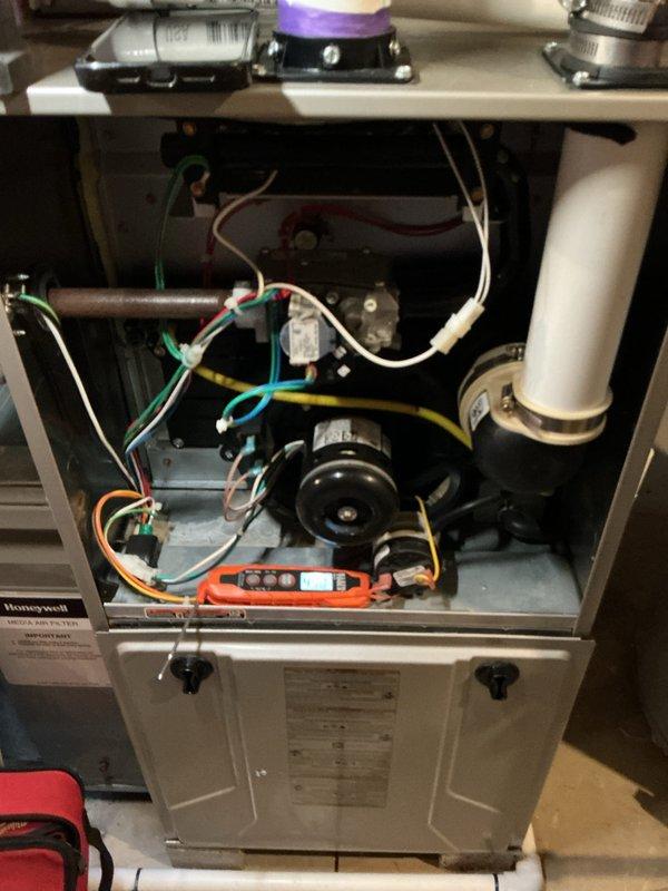Completed annual heating maintenance on residential furnace system. Performed comprehensive inspection of all major components including blower motor assembly, gas valve, heat exchanger, and electrical connections. Tested system operation using digital multimeter to verify proper voltage readings and electrical performance. Inspected ductwork, condensate drain lines, and all wiring harnesses for signs of wear or damage. All components found to be in functional condition with normal dust accumulation noted on interior surfaces. Customer may need to purchase replacement air filters and equipment pads for ongoing maintenance.