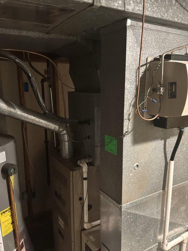 Completed full system estimate for residential HVAC replacement in basement mechanical room. Evaluated existing 16-year-old furnace and associated components including ductwork, refrigerant lines, and water heater configuration. Documented current system layout with photographic evidence showing equipment arrangement, venting, electrical connections, and copper piping. Provided replacement recommendations for aging equipment with customer seeking installation within current season.