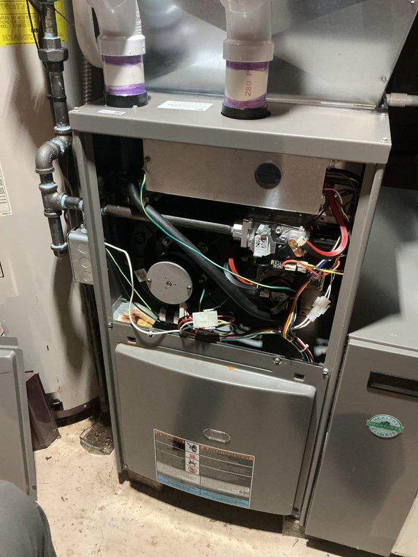 Completed comprehensive winter tune-up and safety inspection on residential gas furnace system. Performed full system diagnostics including burner assembly inspection, heat exchanger examination, blower motor operation verification, and electrical connection testing. All components found operating within manufacturer specifications with no safety concerns identified. Cleaned blower assembly, checked and adjusted gas pressure, verified proper ignition sequence, and tested limit and safety controls. Inspected and documented internal wiring, control board connections, and humidification system components. System demonstrated proper heating operation with adequate airflow and temperature rise across heat exchanger. Recommended continued annual maintenance to ensure optimal performance and longevity of aging equipment.