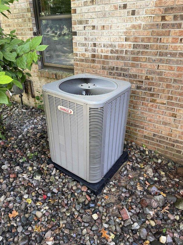 Completed comprehensive AC tune-up and preventative maintenance on residential Lennox outdoor condensing unit. Performed full system inspection, cleaned condenser coils, checked refrigerant levels and pressures, tested electrical connections and capacitor, verified proper airflow through louvers, and confirmed unit operation within manufacturer specifications. System operating efficiently with no issues identified; unit and surrounding area found in good condition.