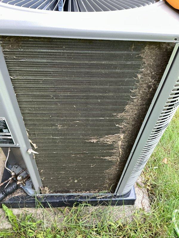 Completed comprehensive Air Care maintenance on residential air conditioning system. Upon arrival, performed thorough inspection of outdoor condensing unit and found condenser coil heavily contaminated with dirt, dust, and debris accumulation, significantly restricting airflow through the fins. Cleaned condenser coil to restore proper heat transfer efficiency. Measured and recorded system amperage at 0.64A during operation. Verified electrical connections, tested capacitor performance, and confirmed all safety controls functioning properly. System operating within normal parameters following maintenance completion.