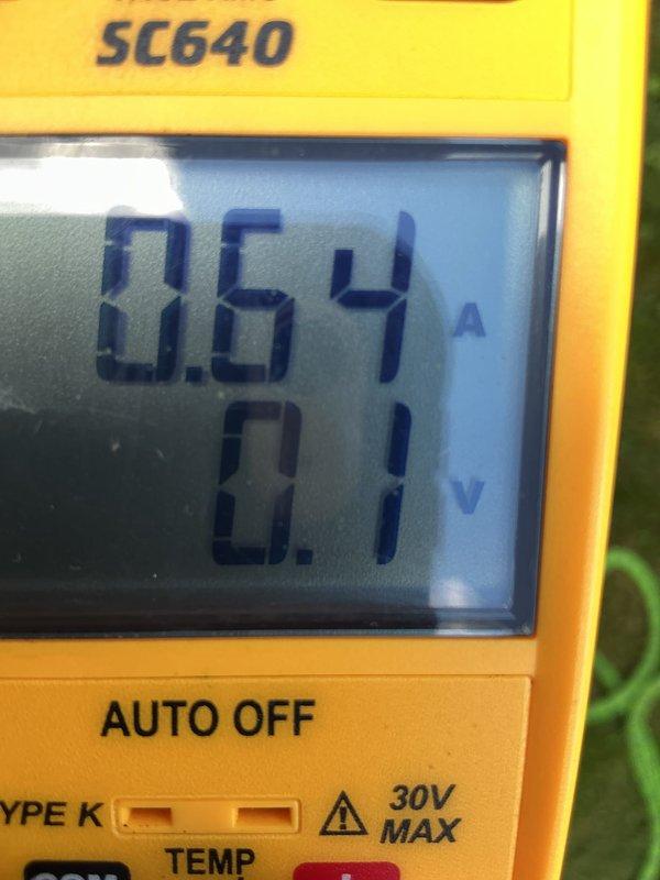 Completed comprehensive Air Care maintenance on residential air conditioning system. Upon arrival, performed thorough inspection of outdoor condensing unit and found condenser coil heavily contaminated with dirt, dust, and debris accumulation, significantly restricting airflow through the fins. Cleaned condenser coil to restore proper heat transfer efficiency. Measured and recorded system amperage at 0.64A during operation. Verified electrical connections, tested capacitor performance, and confirmed all safety controls functioning properly. System operating within normal parameters following maintenance completion.