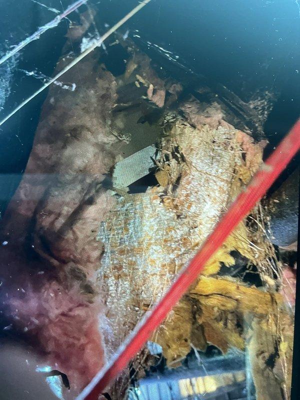 Responded to service call for furnace system damaged by animal intrusion in crawl space. Upon inspection, discovered extensive damage to flexible ductwork and internal furnace components caused by animals chewing through insulation and mechanical parts. Documented severely deteriorated insulation material showing contamination, moisture damage, and compromised integrity within air handler unit. Assessed damaged flexible duct system with compromised insulation wrapper and identified multiple sections requiring replacement. Photographed extent of damage to ductwork and interior components for documentation purposes. Provided customer with assessment of necessary repairs including duct replacement and component restoration to restore system functionality and maintain proper airflow efficiency.