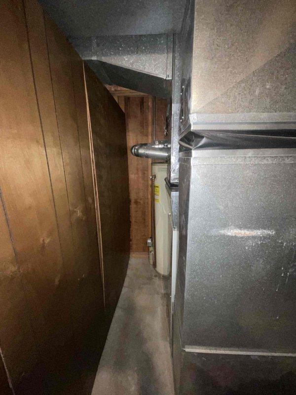 Responded to customer request for furnace replacement estimate due to squeaky noise from 28-year-old unit located in basement. Assessed existing heating system and surrounding utility area, documenting equipment condition and installation space constraints. Provided comprehensive replacement options and recommendations based on equipment age, current performance issues, and absence of existing warranty coverage.