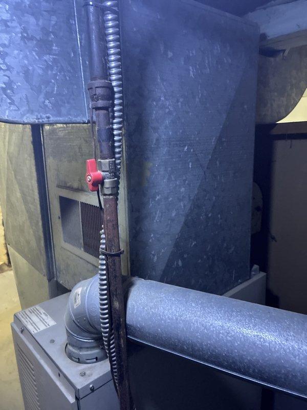 Conducted comprehensive on-site assessment of existing 20-year-old forced air furnace system for full replacement estimate. Inspected current HVAC installation including air handler unit, ductwork connections, refrigerant lines with protective covering, supply and return plenum configurations, and shutoff valve accessibility. Evaluated existing infrastructure condition, clearance requirements, and determined replacement equipment specifications suitable for the space. Documented system configuration and measurements through photographic documentation of mechanical room layout, galvanized ductwork connections, and current equipment positioning to prepare accurate replacement proposal for homeowner.