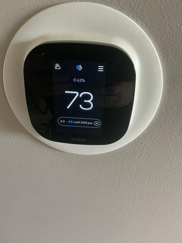 Completed Air Care Maintenance on residential cooling system. Performed comprehensive inspection of outdoor condenser unit, verified proper operation of fan assembly and airflow through louvered panels. Checked ecobee smart thermostat functionality, confirmed temperature control settings and humidity monitoring at 62%. System operating efficiently with temperature maintaining setpoint of 73°F and programmed schedule functioning correctly.
