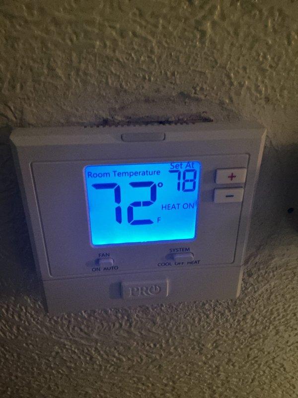 Completed scheduled air handler maintenance service. Inspected thermostat operation confirming proper heating system functionality with unit maintaining 72°F room temperature. Accessed air handler unit, inspected internal components including ductwork connections, electrical connections, control board, and gas valve assembly. Replaced air filter and evaporator pad per maintenance protocol.
