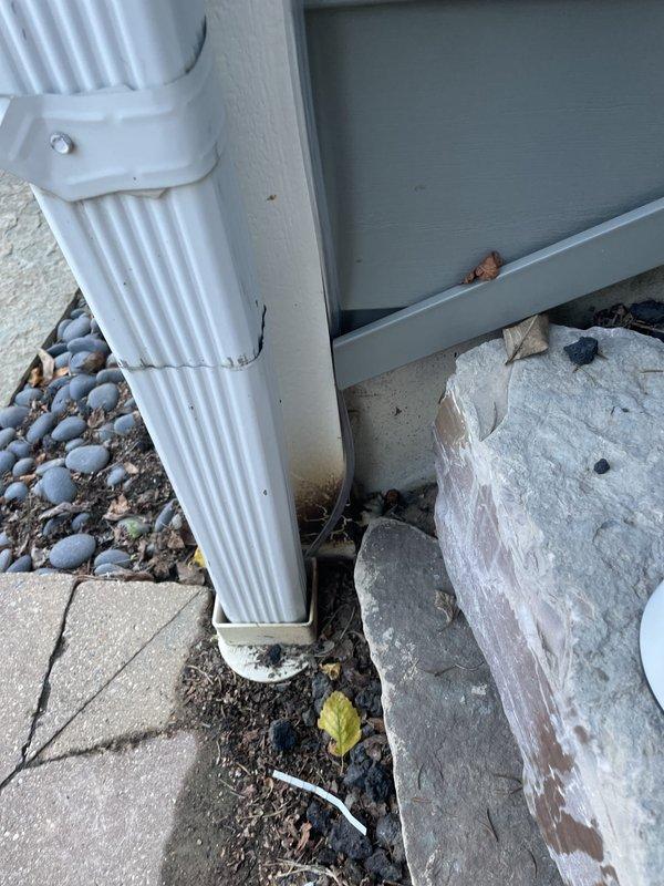 Completed full installation of Mitsubishi Electric mini-split heat pump system including outdoor condenser unit mounted on exterior wall with proper brackets, refrigerant line sets routed vertically with white line covers, electrical junction box installation, and new dedicated circuit. All mechanical and electrical permits obtained and work performed to code specifications, with system tested and operational upon completion.