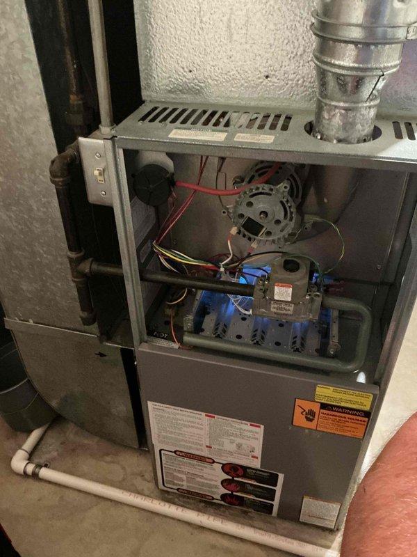Responded to no heat call on 16-year-old residential furnace system experiencing operational noise issues. Upon inspection, accessed furnace cabinet and evaluated internal components including blower motor assembly, gas valve, and electrical connections. Identified failed inducer motor as primary cause of no heat condition. Replaced defective inducer motor, verified proper gas valve operation, inspected all wire connections and safety controls, and tested system startup sequence. Unit restored to full operational status with proper heating function confirmed.