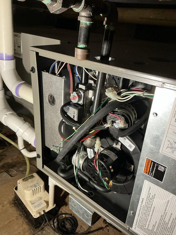 Completed comprehensive AC tune-up and preventive maintenance as part of Air Care membership with no issues reported. Performed full system inspection including blower motor assembly, electrical connections, and condensate drain system. All components found operating within normal parameters with proper wiring connections and hardware securely mounted.