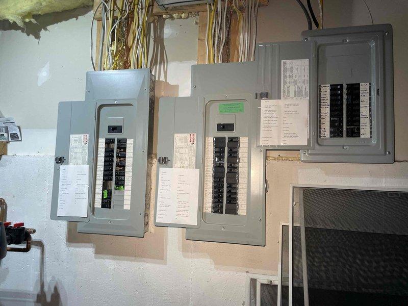 Conducted on-site evaluation for first-time whole home generator installation at manufactured home. Assessed existing electrical infrastructure including four-panel distribution system and determined optimal placement location in unfinished utility area near water heater. Documented current electrical configuration, available space for generator unit, and necessary routing for fuel line and electrical connections to support generator integration with existing panels.