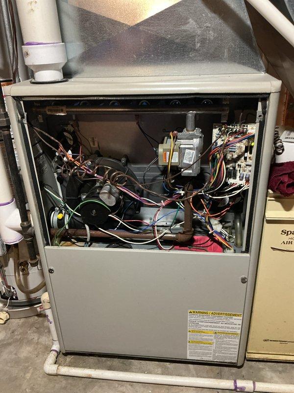 Completed comprehensive tune-up and maintenance on residential gas furnace system. Customer reported fan operating louder than normal; performed thorough inspection of blower motor assembly, verified proper mounting and bearing operation. Conducted full system diagnostics including testing gas valve operation, inspecting heat exchanger, verifying electrical connections and control board functionality, and checking all safety controls. Cleaned blower wheel and housing, lubricated motor bearings as needed, and tightened all mounting hardware to reduce operational noise. Verified proper airflow, tested ignition sequence, confirmed venting and condensate drainage systems operating correctly. System restored to normal operating parameters with reduced noise levels.