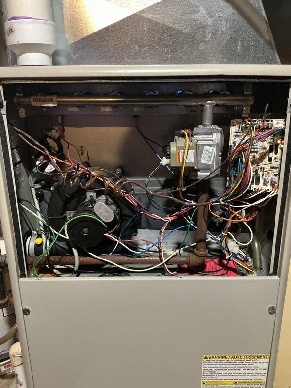 Completed comprehensive tune-up and maintenance on residential gas furnace system. Customer reported fan operating louder than normal; performed thorough inspection of blower motor assembly, verified proper mounting and bearing operation. Conducted full system diagnostics including testing gas valve operation, inspecting heat exchanger, verifying electrical connections and control board functionality, and checking all safety controls. Cleaned blower wheel and housing, lubricated motor bearings as needed, and tightened all mounting hardware to reduce operational noise. Verified proper airflow, tested ignition sequence, confirmed venting and condensate drainage systems operating correctly. System restored to normal operating parameters with reduced noise levels.