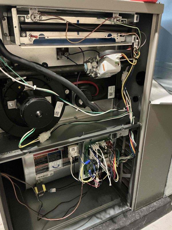 Responded to no-heat call for basement furnace unit. Upon inspection, accessed interior cabinet and performed diagnostic evaluation of electrical and mechanical components. Inspected control board, wiring harnesses, burner assembly, blower motor assembly, and all associated connections. Identified and resolved issue preventing unit operation. Verified proper electrical connections throughout system, checked all wire routing and harness connections, and confirmed control board functionality. Tested burner ignition sequence and blower motor operation. Cycled unit through complete heating cycle to verify proper operation and confirm repair. Unit restored to full operational status with all systems functioning as designed.