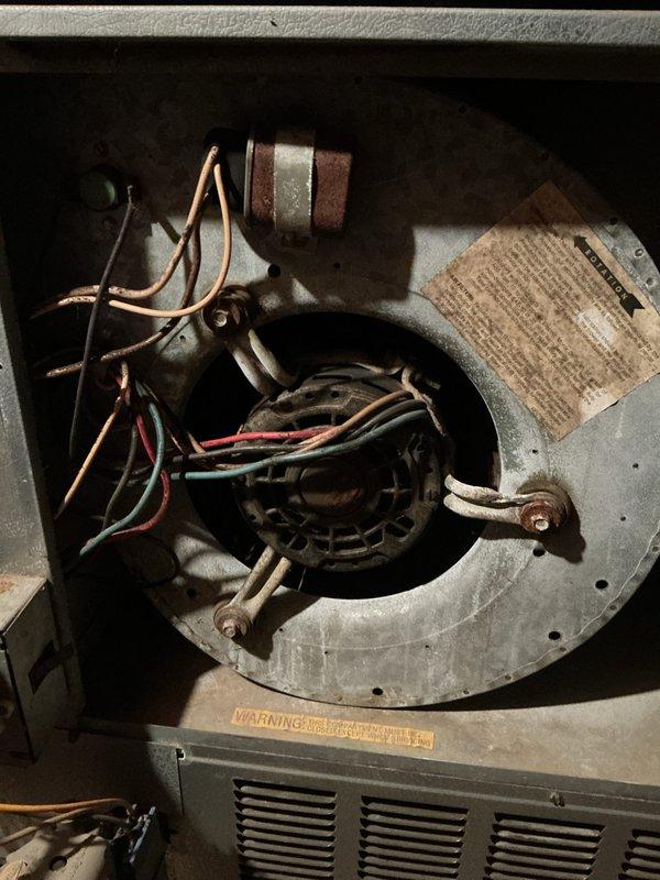 Completed annual HVAC maintenance on heating system located in attic space. Performed comprehensive inspection of blower motor assembly, gas valve controls, and electrical connections. Replaced air filters per SPOTS protocol and verified all wiring connections were secure with proper color coding intact. Inspected transformer unit and control assemblies for proper operation, noting age-related dust accumulation throughout system components.