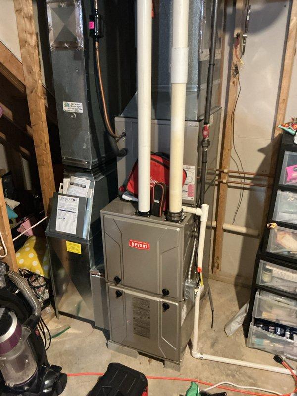 Completed comprehensive furnace tune-up and maintenance on Bryant heating system located in basement mechanical room. Performed standard preventive maintenance procedures including inspection of burner assembly, heat exchanger, blower components, and venting system. Verified proper operation of all safety controls, tested ignition sequence, and confirmed adequate airflow through system. Inspected electrical connections and wiring harnesses for secure terminations and proper voltage. Cleaned flame sensor and checked gas pressure at manifold to ensure efficient combustion. Examined condensate drain lines and PVC venting for proper pitch and drainage. Replaced furnace filter and verified thermostat operation and calibration. System tested through complete heating cycle with no issues observed. All components functioning within manufacturer specifications. Unit operational and ready for heating season.