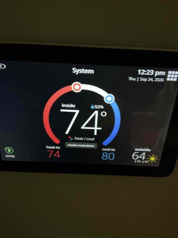 Completed routine ComfortGuard maintenance package on Lennox HVAC system with 4-year-old air conditioning unit and 3-year-old furnace. Performed comprehensive AC tune-up and furnace inspection, verified gas burner operation with proper blue flame pattern, inspected gas valve assembly and pressure switch connections, confirmed all electrical connections secure with proper wiring throughout system. System tested and operating properly with thermostat displaying accurate temperature readings of 74°F indoor temperature at 52% humidity, heat set to 74°F and cooling set to 80°F. All components functioning within normal parameters, no repairs required.
