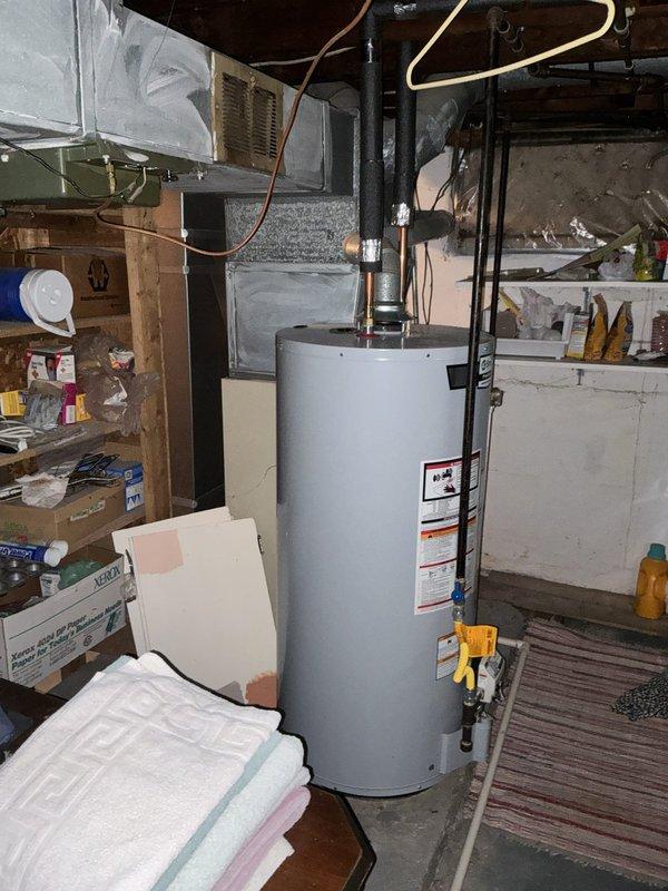 Completed full system HVAC estimate for 20-year-old furnace and air conditioning system replacement under BOGO promotion. Documented existing equipment configuration including air handler unit with return air vent, ductwork connections, and overall system condition in basement mechanical room to provide comprehensive replacement proposal.