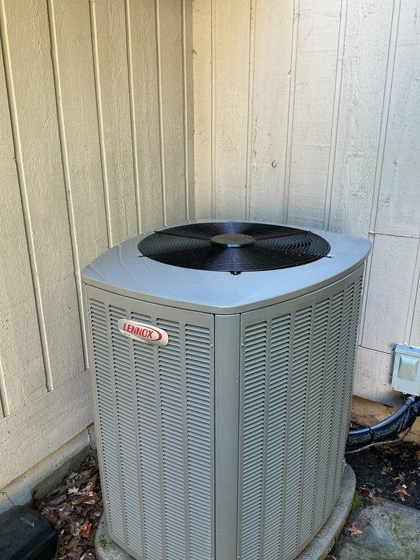 Performed comprehensive preventive maintenance on a 2-year-old Lennox central air conditioning system. Completed full system inspection including condenser unit exterior examination, verified proper refrigerant line connections, and assessed electrical disconnect operation. Noted minor debris accumulation and moss growth on concrete pad around outdoor unit, which is typical for the system's location against exterior wall. System operating within normal parameters with no deficiencies requiring immediate attention at time of service.