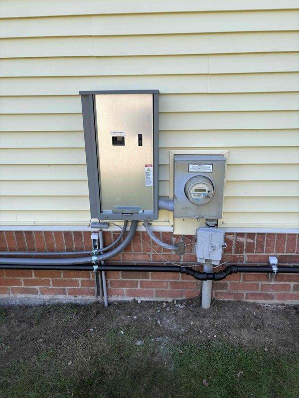 Successfully installed 26KW standby generator (model 26RCA) and automatic transfer switch (model RXT-JFNC-150ASE) at residential property. Mounted generator unit on concrete pad in left side yard with proper clearances, ran electrical conduit from generator to new transfer switch panel installed on exterior wall adjacent to existing utility meter, and completed all gas piping connections with pressure testing to verify system integrity. Wired transfer switch to main electrical panel to provide automatic power transfer for essential circuits during utility outages, performed full system commissioning including load bank testing and transfer switch operation verification, and confirmed proper communication between generator control module and transfer switch. All work completed per approved permit specifications and manufacturer installation requirements.