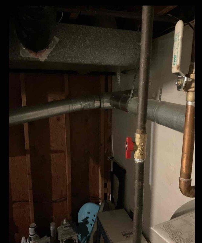 Provided estimate for replacement of non-functional 50-gallon natural gas water heater with new 55-gallon unit. Assessed existing Bradford White water heater installation, including copper supply lines, gas piping with shutoff valve, and metal vent pipe connected to chimney flue. Quoted complete installation service including removal and haul-away of existing unit, with customer requesting to add project to existing financing plan.