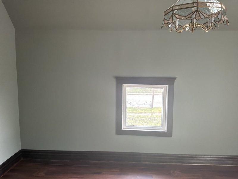 Conducted on-site estimate for mini split installation at newly acquired residential property with no existing HVAC system. Evaluated main living area with hardwood flooring and assessed basement utility space for potential outdoor condenser placement and line routing. Documented room dimensions, electrical access points near utility area with existing dryer connection, and exterior wall penetration requirements for refrigerant lines and condensate drainage.