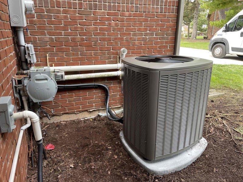 Completed installation of 3-ton air conditioning system with matching evaporator coil at residential property. Positioned new condenser unit on concrete pad at exterior of building, ran refrigerant lines to interior air handler, and installed Bryant-branded indoor unit with proper drainage and ventilation components. Verified all electrical connections, tested system operation, and confirmed proper refrigerant charge and airflow throughout the system.