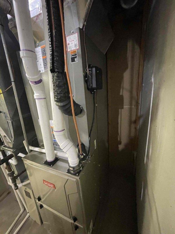 Completed installation of 3-ton air conditioning system with matching evaporator coil at residential property. Positioned new condenser unit on concrete pad at exterior of building, ran refrigerant lines to interior air handler, and installed Bryant-branded indoor unit with proper drainage and ventilation components. Verified all electrical connections, tested system operation, and confirmed proper refrigerant charge and airflow throughout the system.