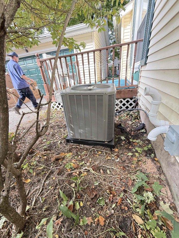 Completed full HVAC system installation including a 70,000 BTU gas furnace and 2.5-ton air conditioning unit. Furnace was installed in basement utility room with proper venting, ductwork connections, and humidifier integration. AC condenser unit was positioned on concrete pad in left side yard with refrigerant lines and electrical connections completed. All mechanical permits were requested and system reconnection was performed to ensure proper operation of both heating and cooling components.