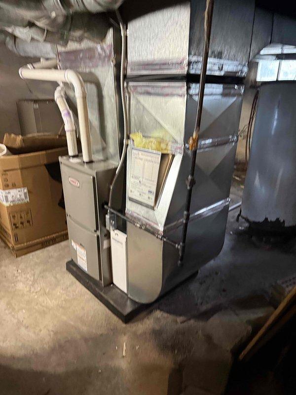 Successfully installed a 70,000 BTU furnace unit in the basement utility area as a furnace-only replacement. Completed all mechanical connections, installed PVC exhaust venting system, and reconnected existing ductwork to the new heating system. Installation performed under mechanical permit and all work completed to code specifications.