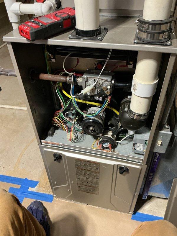 Responded to service call for 20-year-old furnace system in basement not maintaining desired temperature, only reaching 69 degrees. Performed diagnostic inspection of furnace unit with visual examination of internal components including blower motor assembly, gas valve, burner assembly, electrical connections, and control systems. Assessed overall system operation and identified performance limitations consistent with equipment age and condition.