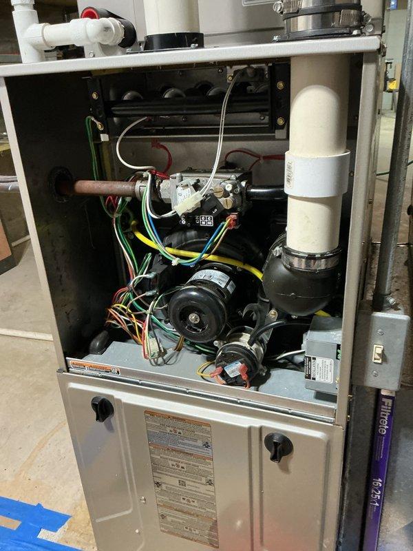 Responded to service call for 20-year-old furnace system in basement not maintaining desired temperature, only reaching 69 degrees. Performed diagnostic inspection of furnace unit with visual examination of internal components including blower motor assembly, gas valve, burner assembly, electrical connections, and control systems. Assessed overall system operation and identified performance limitations consistent with equipment age and condition.