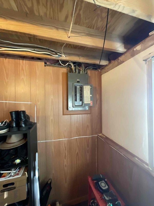 Conducted comprehensive electrical assessment of single-family residence identifying multiple upgrade requirements. Evaluated exterior power box exhibiting severe rust deterioration requiring full replacement, inspected interior breaker panel in basement utility area determining upgrade necessary to meet current electrical demand and code requirements. Assessed interior receptacle needing modernization and performed diagnostic evaluation of garage power supply circuit to verify adequate capacity and proper functionality.