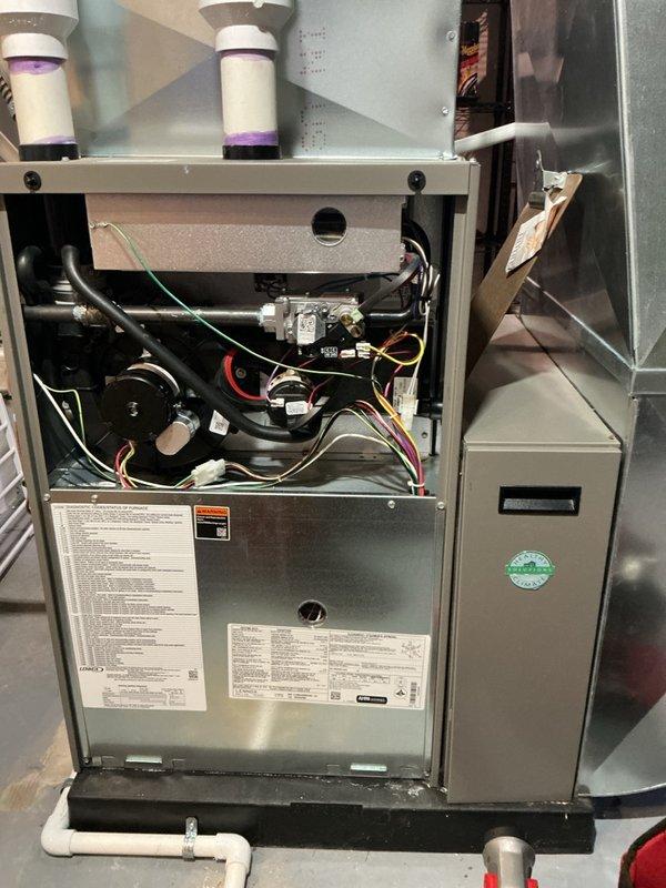 Completed comprehensive tune-up service on multi-unit HVAC system including 4-year-old Lennox furnace, 8-year-old Concord air conditioner, and 29-year-old Lennox unit. Performed full system inspection with access panel removal, verified proper operation of all internal components including control boards, wiring harnesses, and condensate management systems. Conducted outdoor condenser unit evaluation, confirming adequate airflow through mesh grille and proper mounting on concrete pad with surrounding drainage considerations.