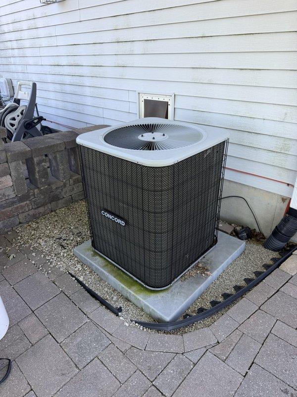 Completed comprehensive tune-up service on multi-unit HVAC system including 4-year-old Lennox furnace, 8-year-old Concord air conditioner, and 29-year-old Lennox unit. Performed full system inspection with access panel removal, verified proper operation of all internal components including control boards, wiring harnesses, and condensate management systems. Conducted outdoor condenser unit evaluation, confirming adequate airflow through mesh grille and proper mounting on concrete pad with surrounding drainage considerations.