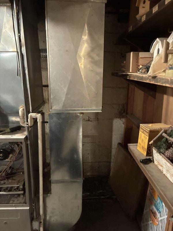 Conducted comprehensive assessment of 24-year-old natural gas furnace and air conditioning system located in basement mechanical room. Current equipment remains operational but experienced performance issues during previous cooling season with limited parts availability due to age of units. Evaluated existing HVAC configuration including furnace with blower assembly, ductwork plenum system, and associated components to provide replacement equipment recommendations for both heating and cooling systems.