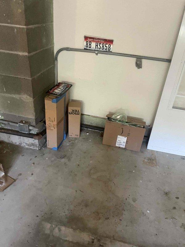 Completed comprehensive electrical estimate for secondary panel evaluation in garage utility space. Assessed existing breaker panel condition and capacity to address non-functional dryer outlet and potential 240V EV charging circuit installation. Documented current panel configuration showing main breaker and approximately 19 branch circuits, evaluated available capacity for additional high-amperage circuits, and photographed existing electrical infrastructure including conduit routing and panel accessibility for future upgrade recommendations.