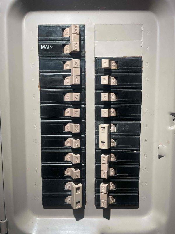 Completed comprehensive electrical estimate for secondary panel evaluation in garage utility space. Assessed existing breaker panel condition and capacity to address non-functional dryer outlet and potential 240V EV charging circuit installation. Documented current panel configuration showing main breaker and approximately 19 branch circuits, evaluated available capacity for additional high-amperage circuits, and photographed existing electrical infrastructure including conduit routing and panel accessibility for future upgrade recommendations.