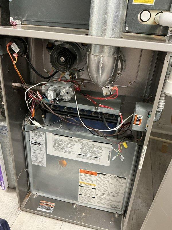 Completed annual heating maintenance on residential forced-air furnace system. Performed comprehensive inspection of all internal components including blower motor assembly, draft inducer, gas valve, heat exchanger, burner assembly, electrical connections, and control board. Verified proper operation of all safety systems, checked wiring harnesses for secure connections, and confirmed unit specifications against manufacturer labels. All components found in working condition with no repairs needed at this time.