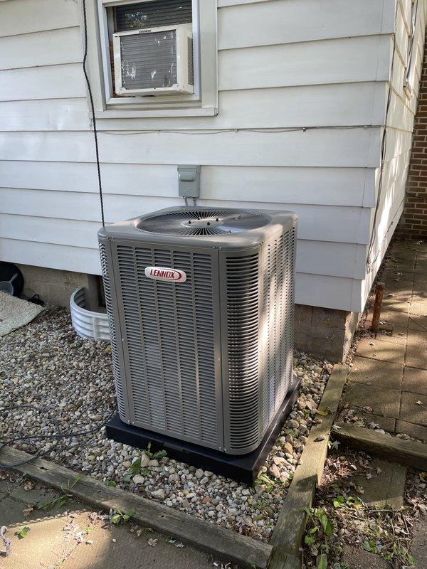 Completed full HVAC system replacement including installation of a 70,000 BTU gas furnace with new liner and 2-ton air conditioning unit with rear discharge configuration. Performed all mechanical and electrical connections, installed custom sheet metal plenum and ductwork transitions in basement, and established new dedicated electrical circuit for system operation. Mounted outdoor condenser unit on gravel base pad with proper clearances, completed refrigerant lines, condensate drainage, and verified all system components are operational per manufacturer specifications.
