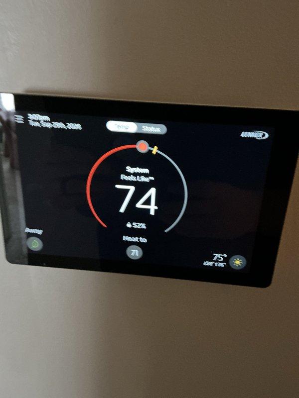 Completed annual preventive maintenance on residential air conditioning system approximately 1.5 years old. Performed comprehensive inspection of outdoor condenser unit, verified proper operation of all components, checked refrigerant levels and pressures, cleaned condenser coils, and inspected electrical connections. Confirmed Lennox thermostat programming and system response, with unit maintaining proper temperature control at 74°F set point. All components operating within manufacturer specifications with no deficiencies noted.