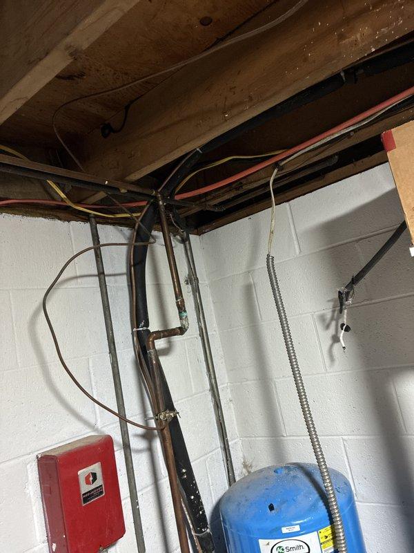 Completed comprehensive estimate for full HVAC system replacement including 20-year-old furnace located in basement and 20-year-old air conditioning unit positioned outside. Assessed existing equipment condition, documented current installations with photos showing basement mechanical room setup with exposed utilities and equipment configuration, and provided replacement options for both heating and cooling systems to address age-related efficiency concerns.