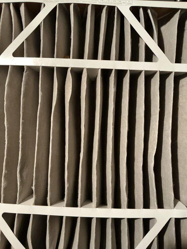 Completed ComfortGuard Maintenance 5-Year recurring service visit on residential HVAC system. Performed comprehensive inspection of furnace unit, including examination of blower motor assembly, gas valve components, electrical connections, and control modules. Inspected air filter showing moderate dust accumulation on pleated media, verified proper airflow, and documented internal mechanical components and wiring harnesses in good operating condition.