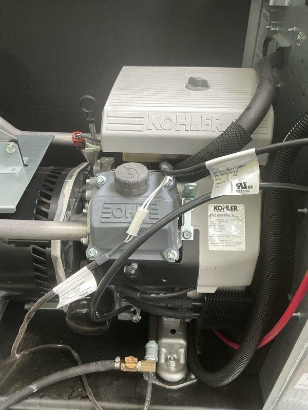 Completed complimentary maintenance service on a 14kW Kohler residential standby generator. Performed standard preventive maintenance procedures including visual inspection of all engine components, electrical connections, and control systems. Investigated customer concern regarding surge protector displaying off status in the main electrical panel; inspected DK surge protection device and verified panel connections. All generator mechanical components, fuel system, battery connections, and wiring harnesses found in satisfactory operating condition with proper routing and secure fastening.