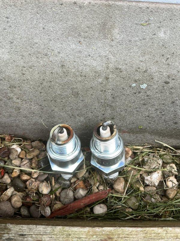 Performed scheduled maintenance on an 11kW Honeywell standby generator using maintenance kit #6483. Completed oil change via drain valve, replaced spark plugs showing normal wear deposits, and conducted full system inspection per manufacturer specifications.