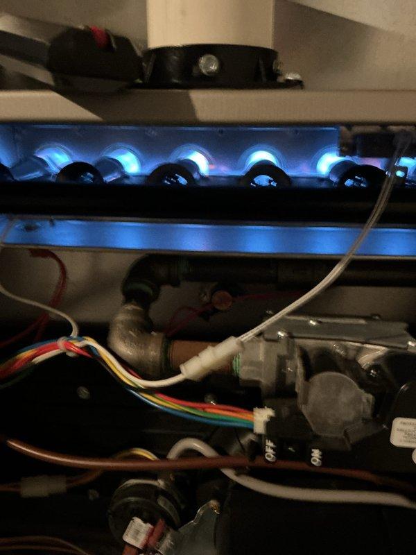 Completed annual heating check on gas furnace system. Inspected burner assembly with all burners firing properly with clean blue flames, verified gas valve operation and connections, checked electrical components and wiring harness, and replaced furnace filter per customer request. All safety controls, ignition system, and flame sensor tested and confirmed operational. System running efficiently with no issues found.