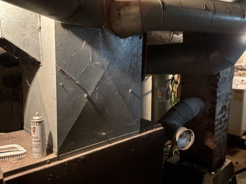 Conducted on-site assessment for new forced air furnace installation at single-family farm home currently heated by outdoor wood boiler with no existing forced air system. Evaluated basement mechanical room conditions, existing ductwork infrastructure, and equipment placement requirements for complete HVAC system installation to replace wood boiler heating method.